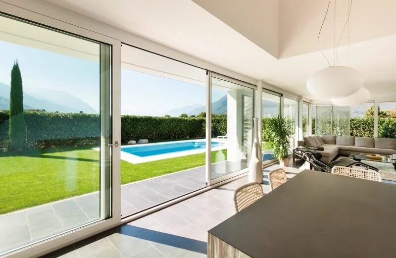 Aluminium sliding doors with Planitherm double glazing for energy efficiency