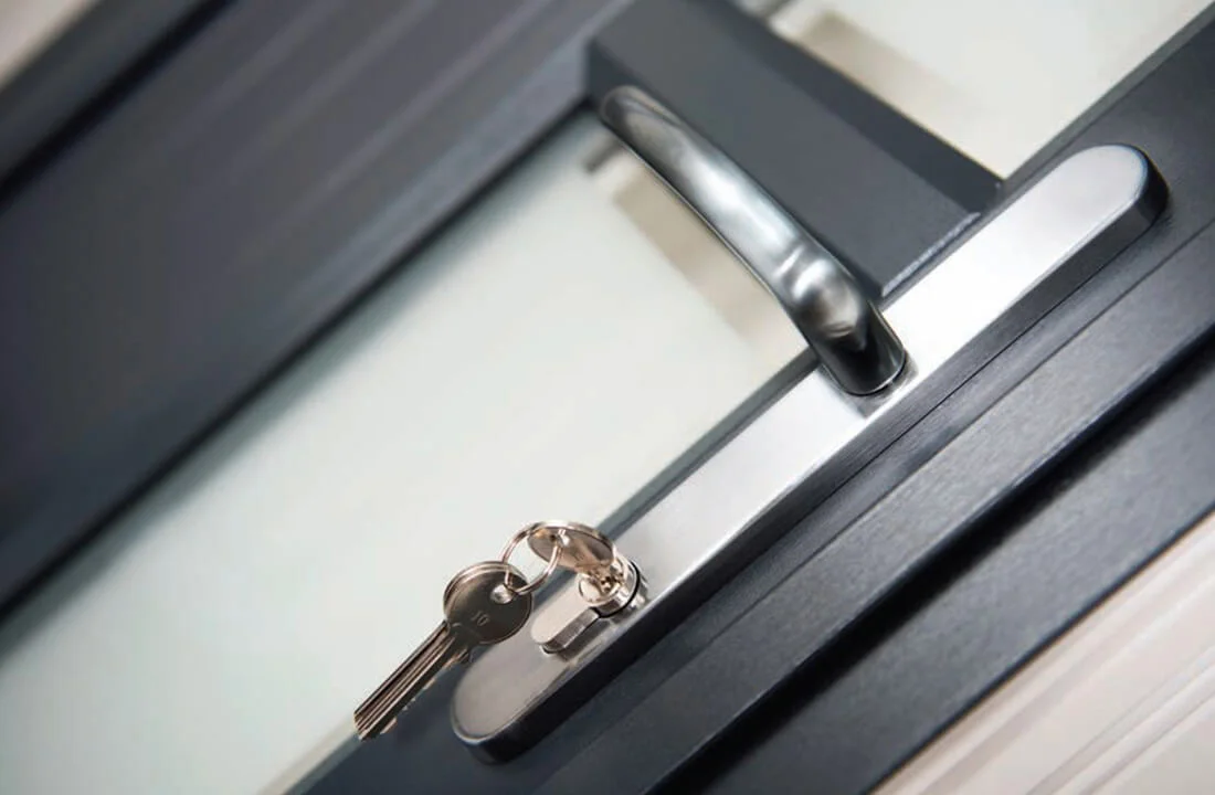 Black uPVC entrance door showing security features