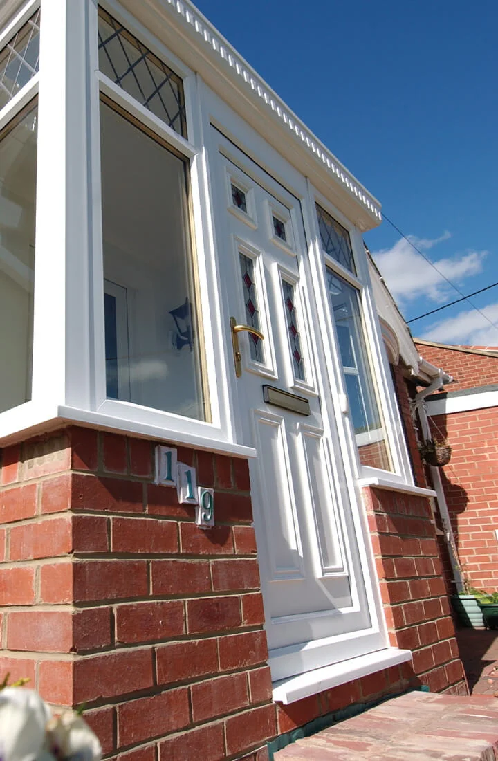 White uPVC entrance door and porch showing energy efficiency