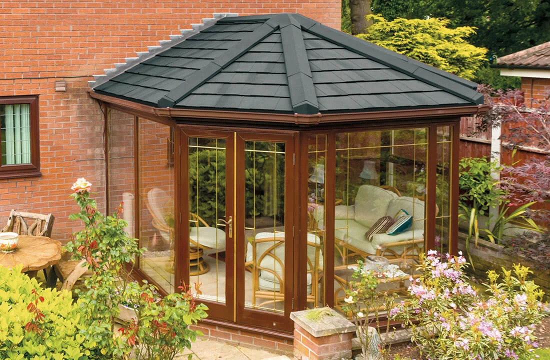 Victorian conservatory with charcoal tiled roof