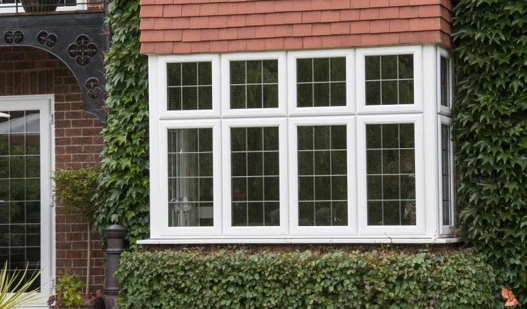 uPVC bay window with traditional woodgrain finish on Victorian property