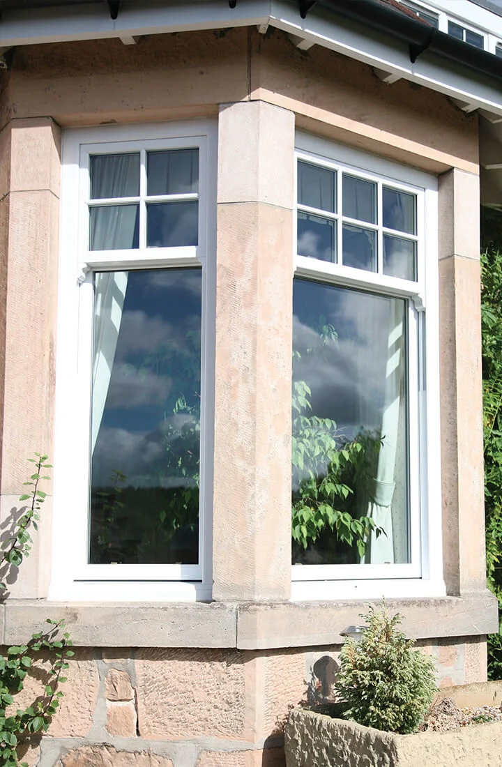 uPVC sash windows in woodgrain Rosewood and Irish Oak finishes