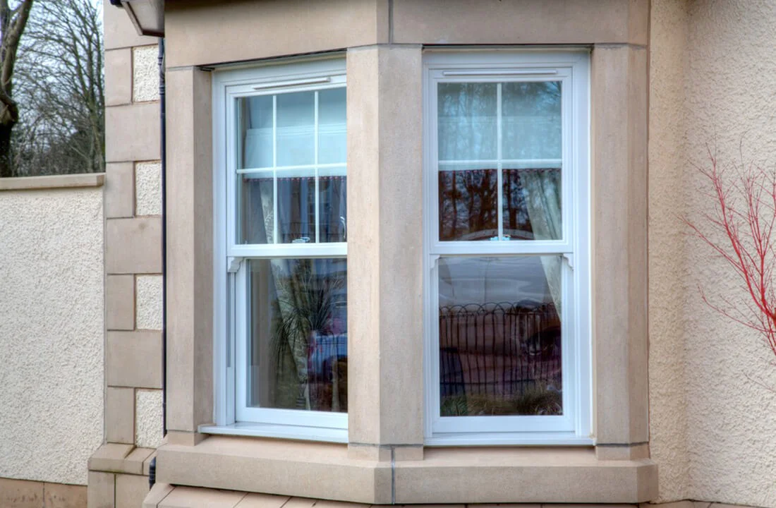 uPVC sash window showing multi-chambered profile and Planitherm glazing