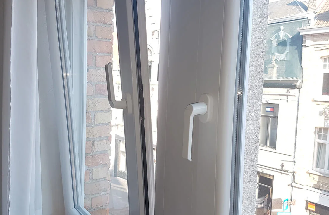 Interior view of tilt and turn window showing multi-chambered frame